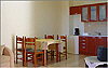 Apartment - dining table and kitchenette